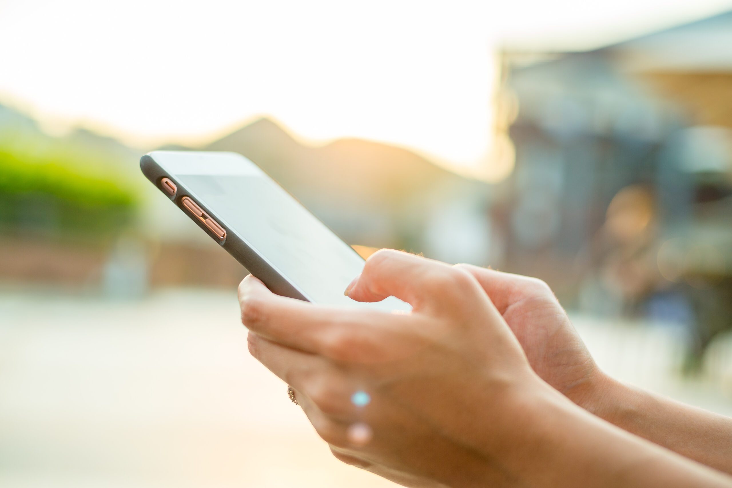 Why choose an iPhone for business Woman,Using,Cellphone,At,Outdoor